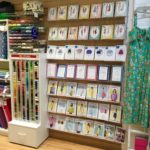 Wall display of sewing patterns from independent pattern designers