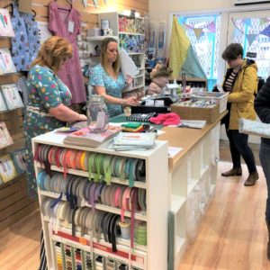 Customers in sewing shop