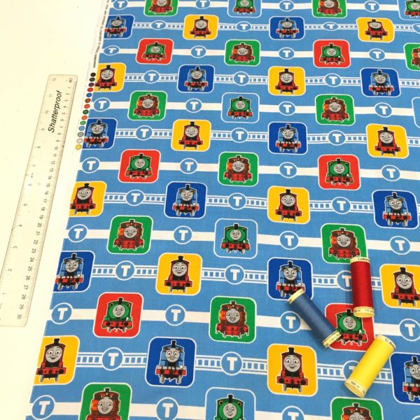 Blue cotton fabric showing Thomas the Tank Engine trains