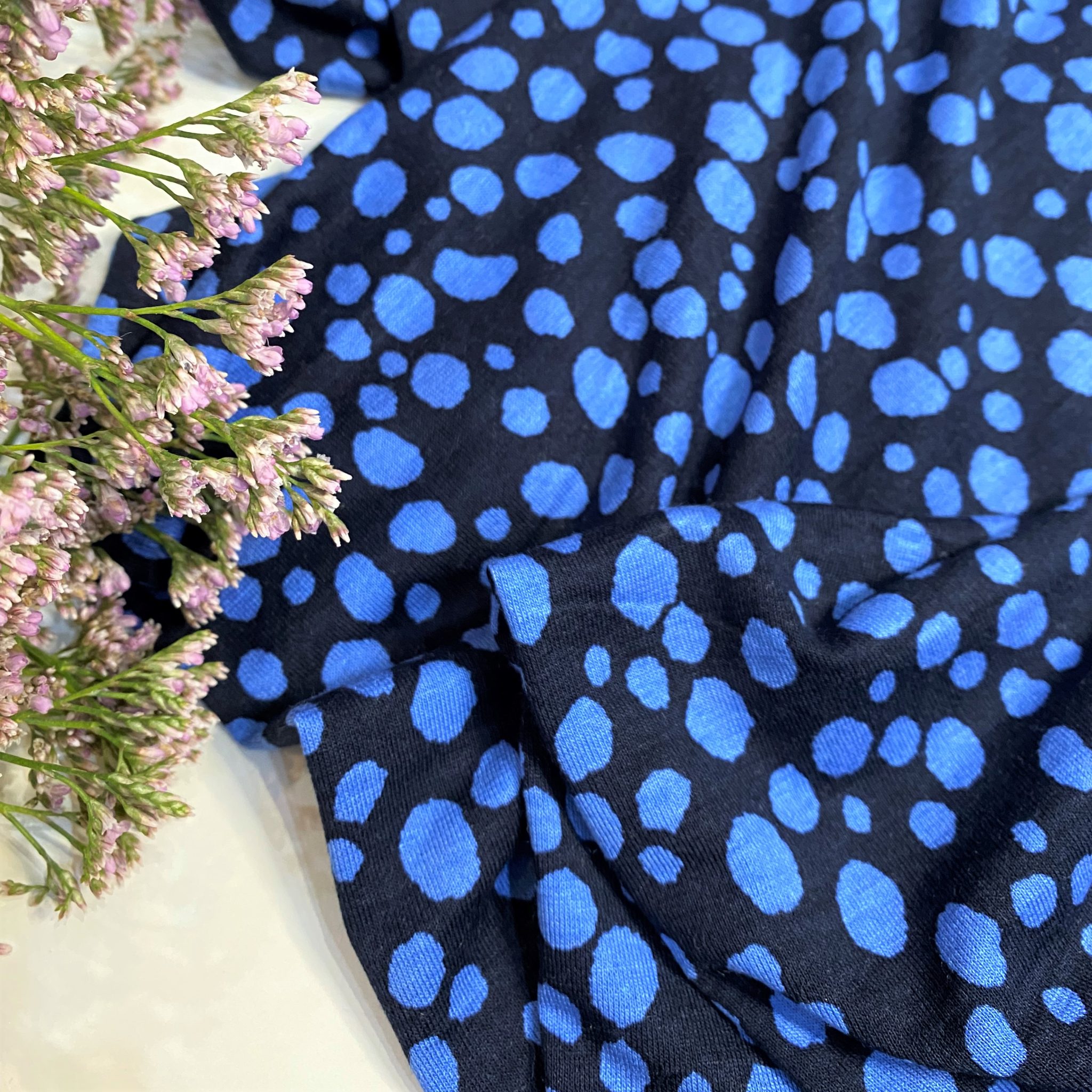 viscose-jersey-fabric-spotty-dotty-blue-spots-on-navy-blue-gather