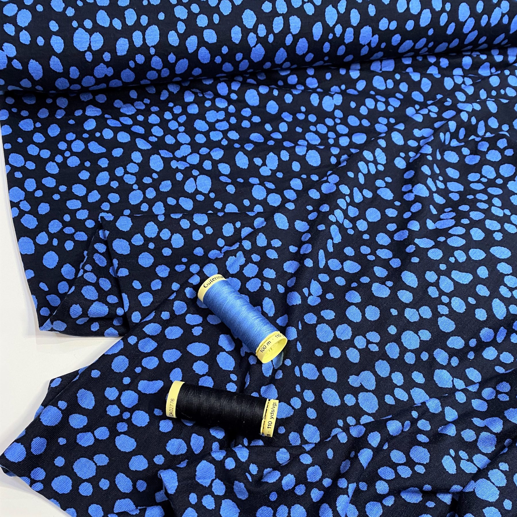 Viscose jersey fabric Spotty Dotty blue spots on navy blue Gather